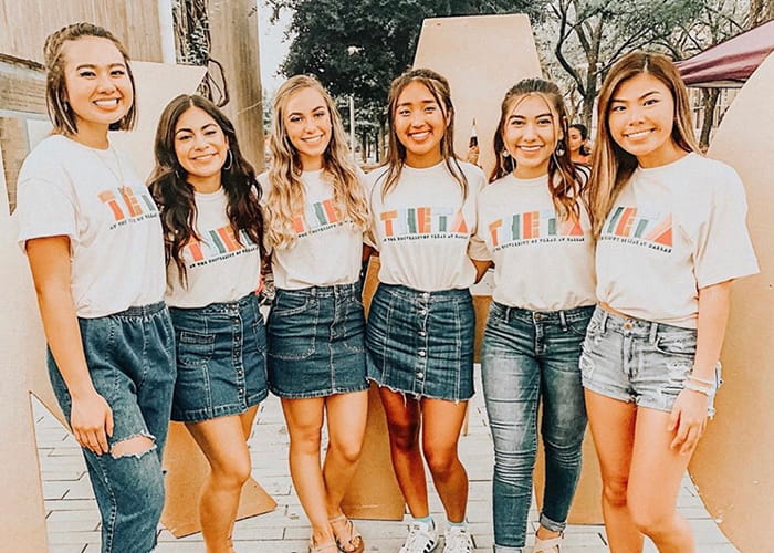Group photo of six women wearing Theta t-shirts.